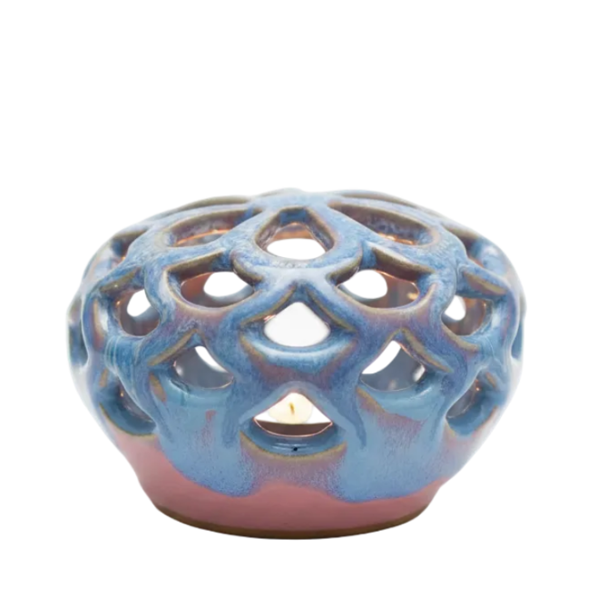 Ceramic incense burner with lattice design on a white background