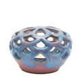 Ceramic incense burner with lattice design on a white background